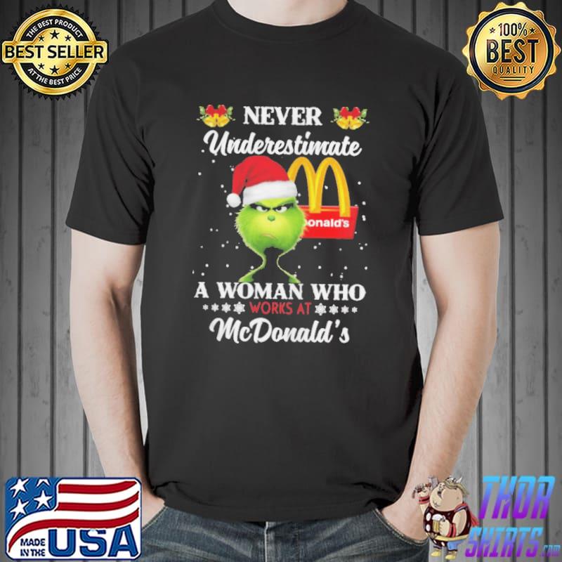 Grinch Santa Hat Never Underestimate A Woman Who Works At McDonald’s Merry Christmas Shirt Unisex