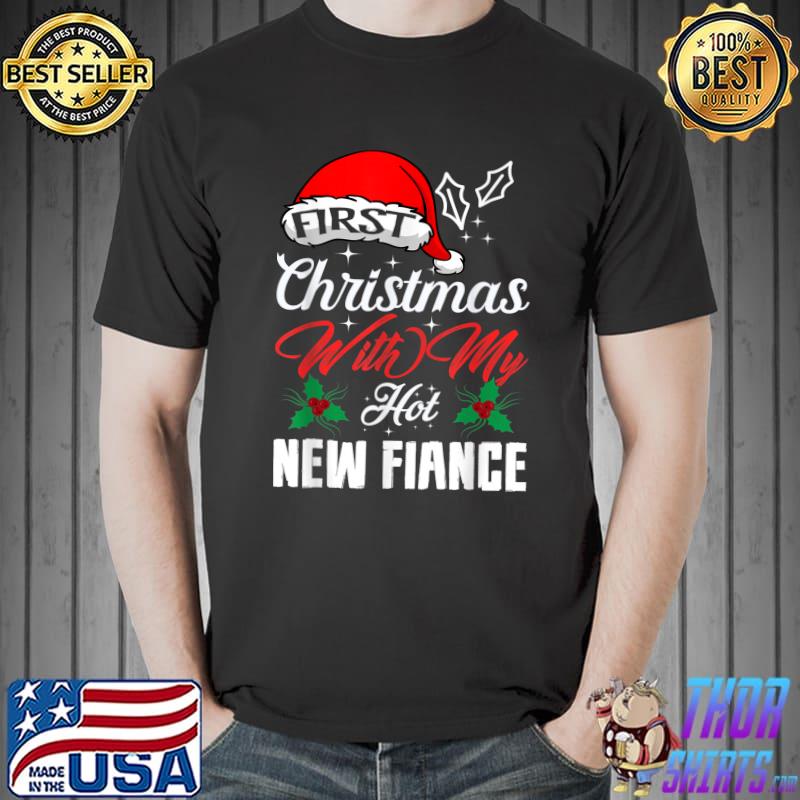 https://images.thorshirts.com/2021/11/original-first-christmas-with-my-hot-new-fiance-engaged-couple-xmas-t-shirt-Unisex.jpg