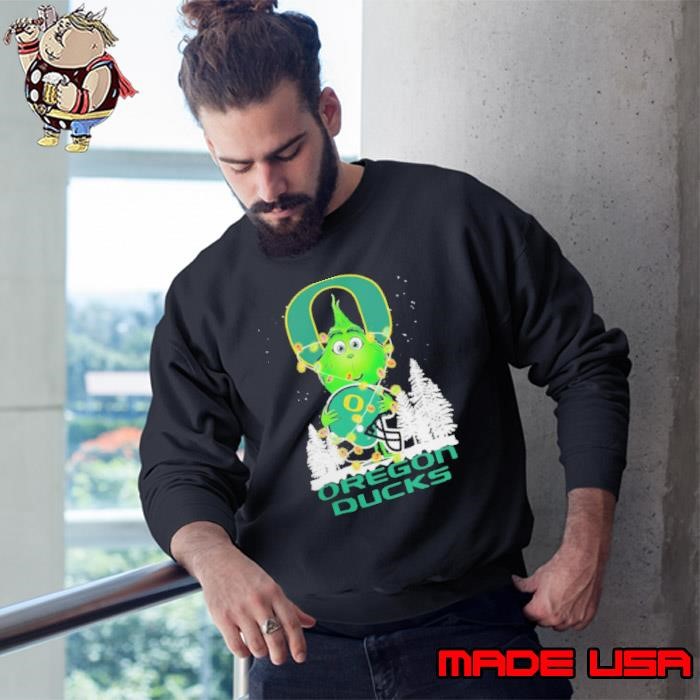 The Grinch Hug Oregon Ducks Helmet Christmas Sweatshirt